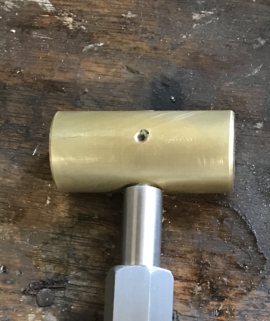 The hammer head with the handle pinned in place